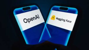 A hand holds a phone showing the OpenAI and Hugging Face logos